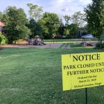 A closed sign posted in front of Thayer Street Park