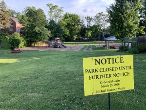 A closed sign posted in front of Thayer Street Park